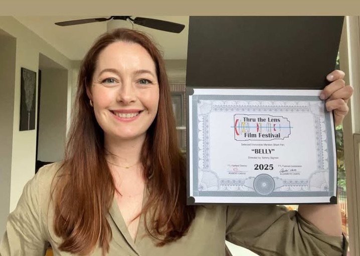 Sarah holding certificate