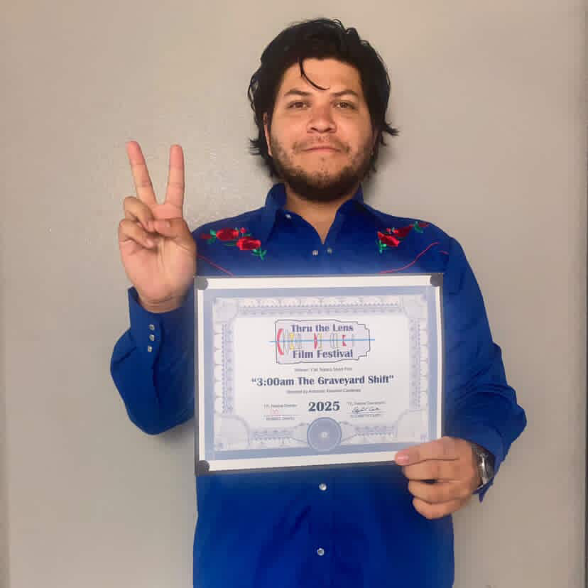 Armando holding certificate