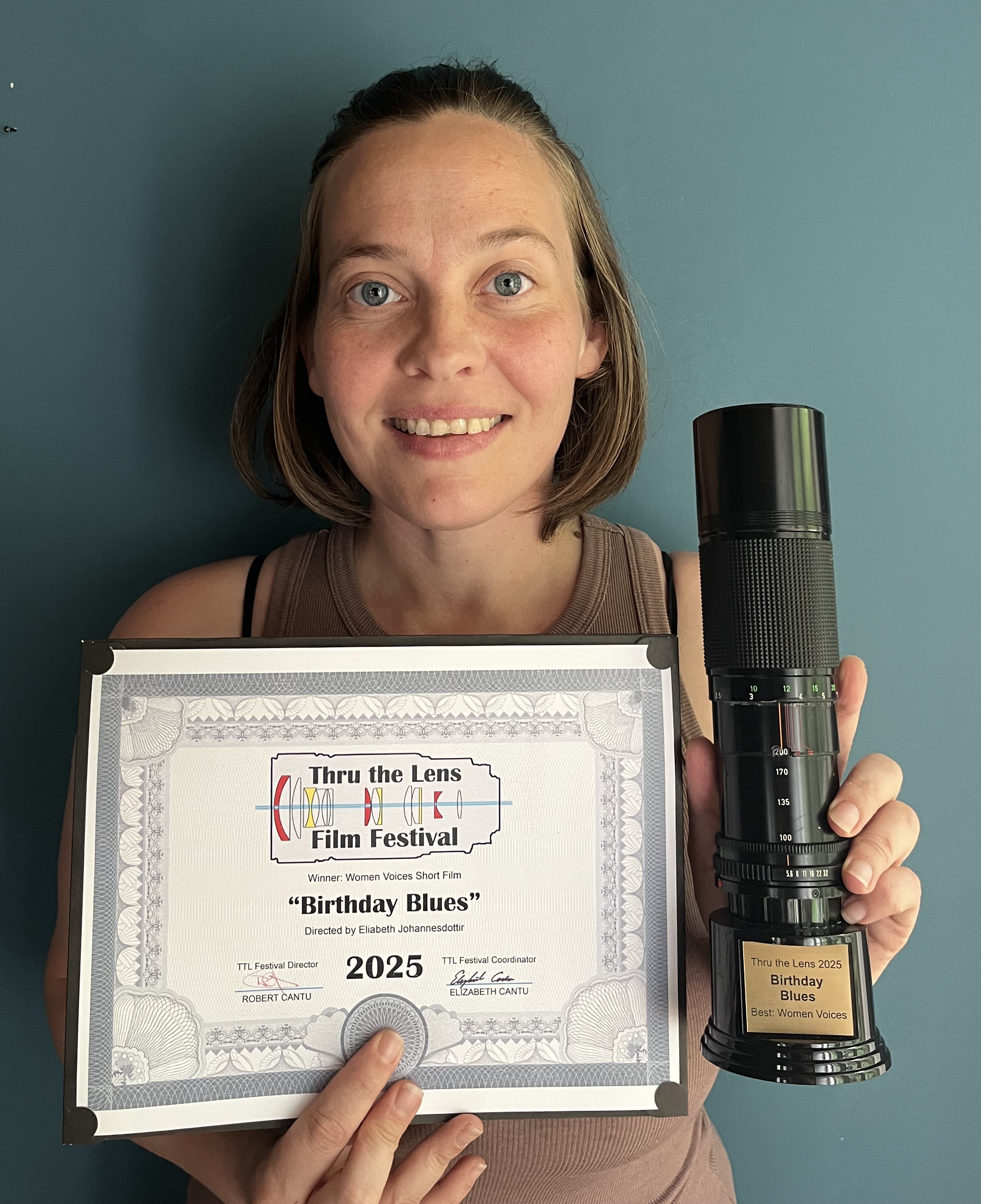 Elizabeth holding certificate