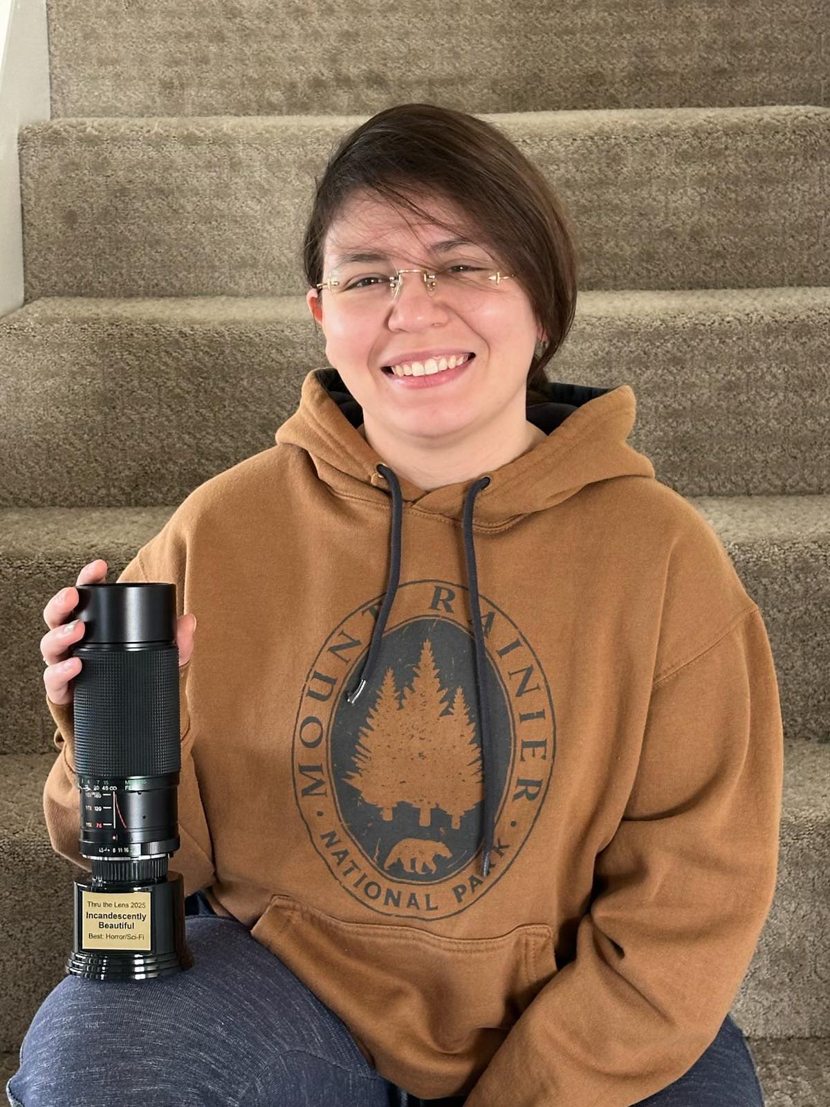 Tyler holding trophy